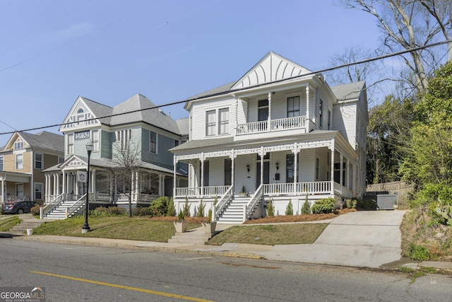 view of front of house featuring covered porch and a balcony