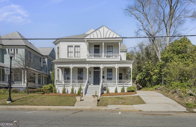 view of front of home featuring a balcony and a porch