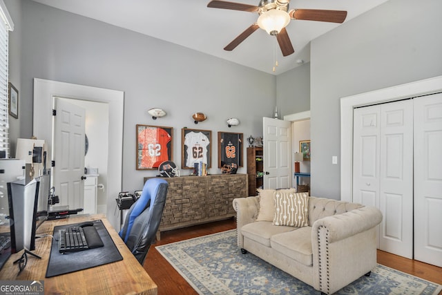 office featuring high vaulted ceiling, wood finished floors, and a ceiling fan