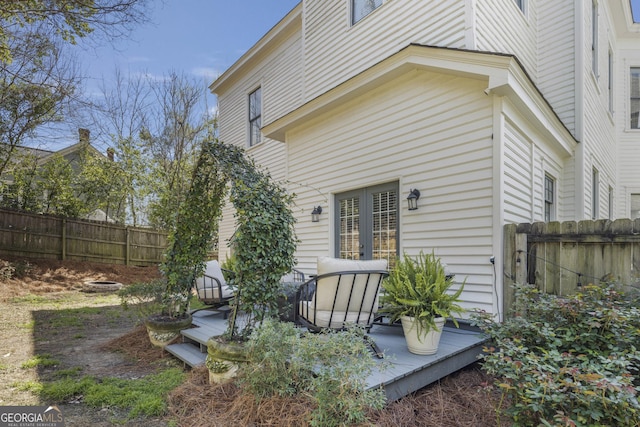 back of property featuring fence