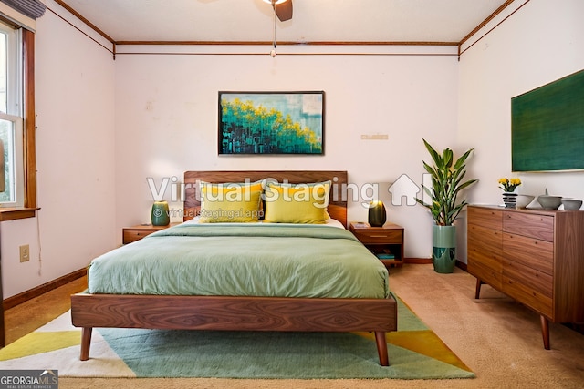 carpeted bedroom featuring baseboards and crown molding