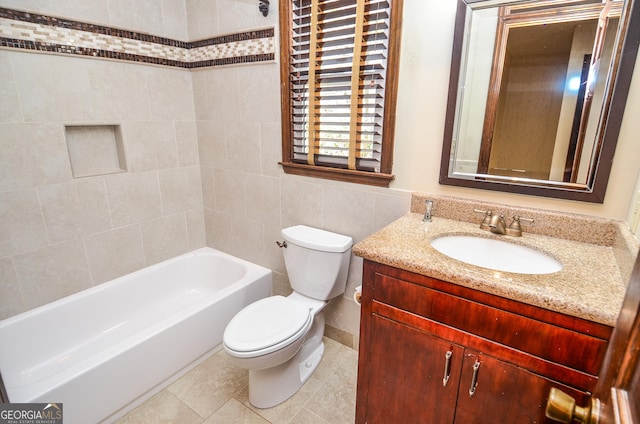 bathroom featuring vanity, tile walls, toilet, and tile patterned flooring