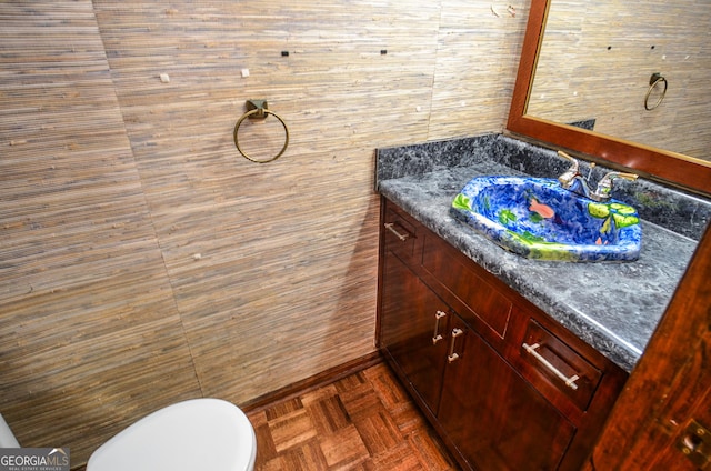 bathroom with toilet and vanity