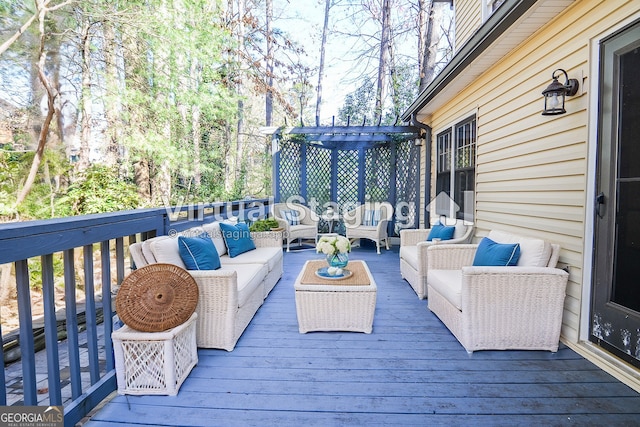 wooden deck featuring outdoor lounge area and a pergola