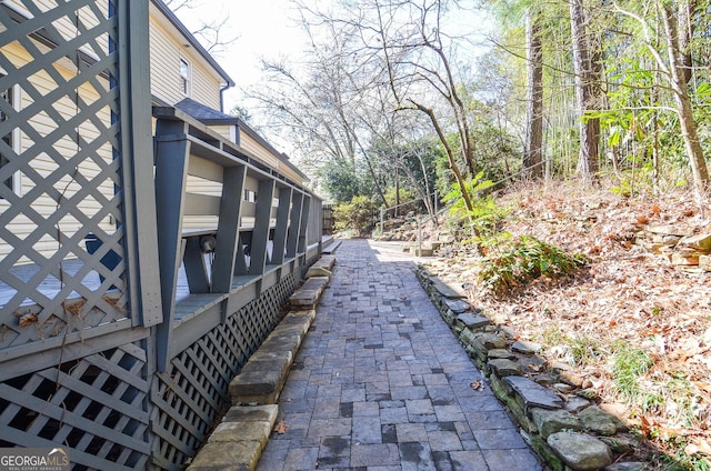 view of side of property featuring roof with shingles