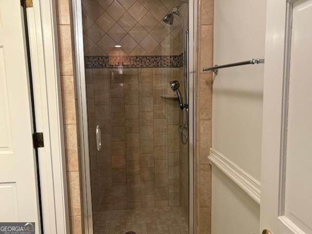 full bathroom with a shower stall