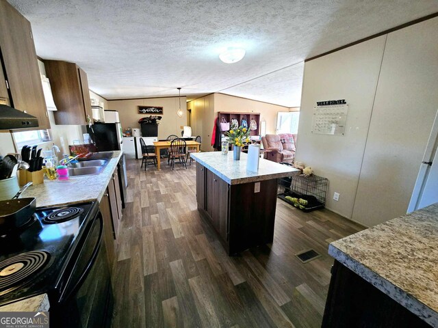 kitchen with visible vents, black range with electric stovetop, vaulted ceiling, a textured ceiling, and dark wood-style flooring