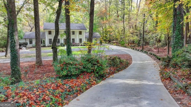 view of property's community with a forest view