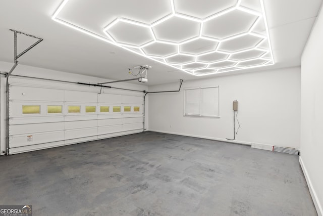 garage featuring baseboards and a garage door opener