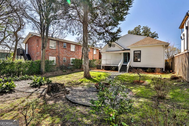 back of property featuring fence