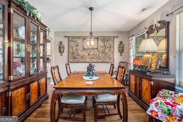 410 Bowen Rd NE, White, GA 30184 - dining space with visible vents and wood finished floors