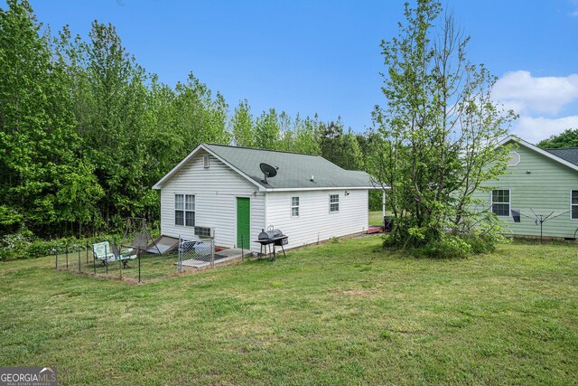 410 Bowen Rd NE, White, GA 30184 - back of property featuring a yard