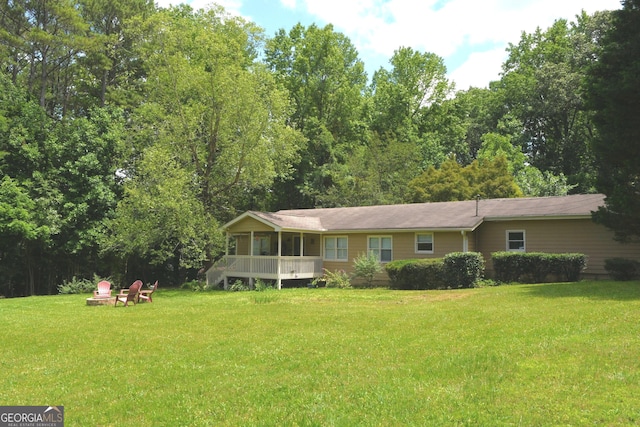 1537 David Lee St, Acworth, GA 30102 - back of property with an outdoor fire pit and a lawn