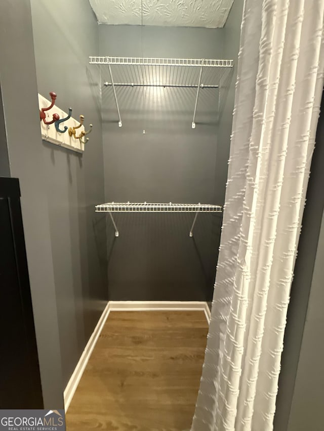 1537 David Lee St, Acworth, GA 30102 - walk in closet featuring wood finished floors