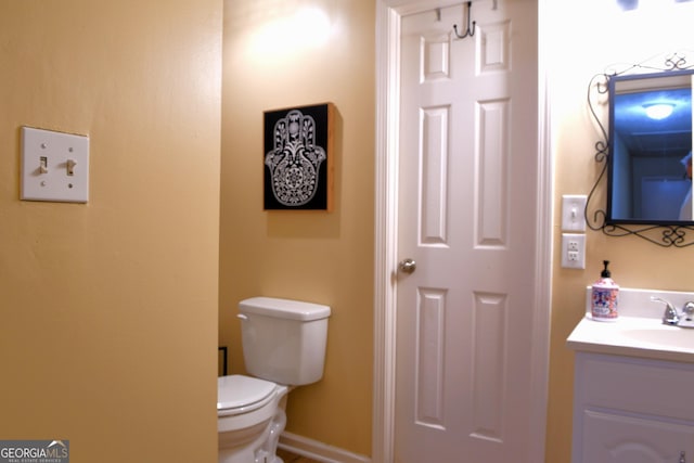 1537 David Lee St, Acworth, GA 30102 - bathroom with vanity, toilet, and baseboards