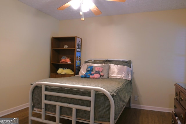 1537 David Lee St, Acworth, GA 30102 - bedroom with wood finished floors, baseboards, and a ceiling fan