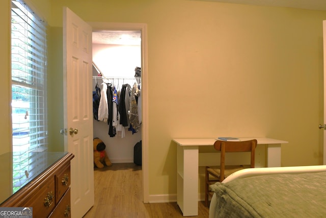 1537 David Lee St, Acworth, GA 30102 - bedroom with light wood finished floors, baseboards, and a closet