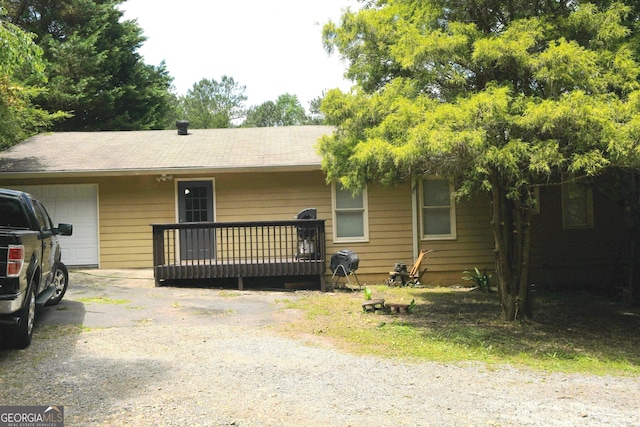 1537 David Lee St, Acworth, GA 30102 - view of front of home featuring a garage, roof with shingles, and driveway