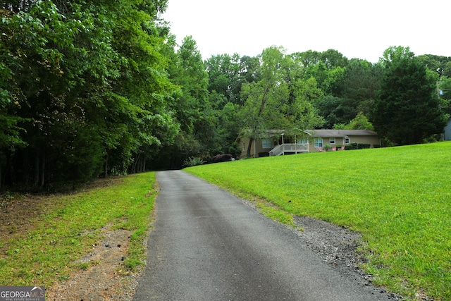 1537 David Lee St, Acworth, GA 30102 - view of asphalt driveway with a forest view