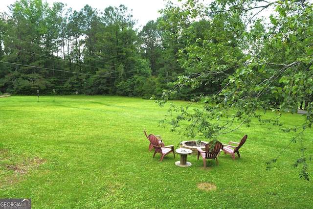 1537 David Lee St, Acworth, GA 30102 - view of grassy yard with an outdoor fire pit