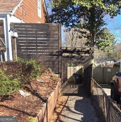 view of property exterior featuring fence