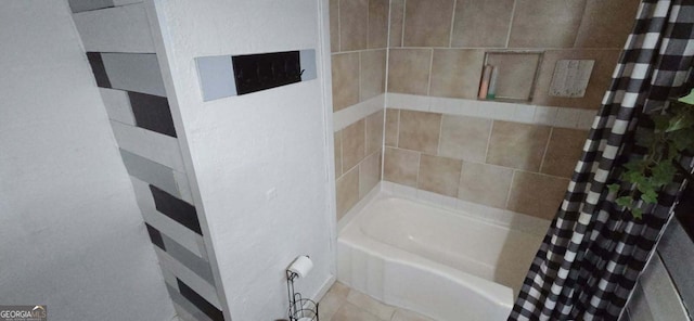 bathroom with a bath and a shower with shower curtain