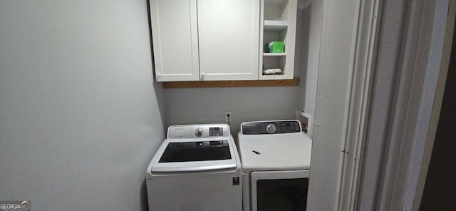 laundry room featuring cabinet space and independent washer and dryer