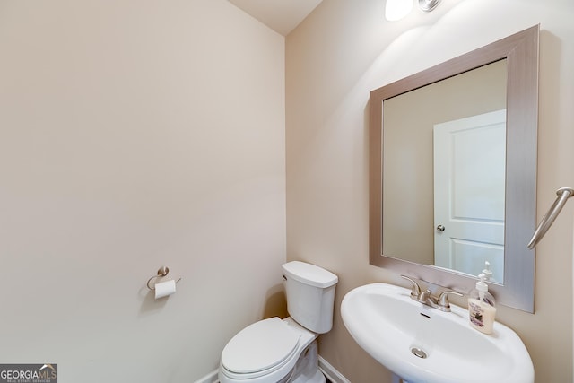 bathroom with a sink and toilet