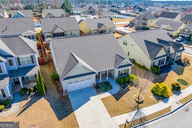 birds eye view of property with a residential view