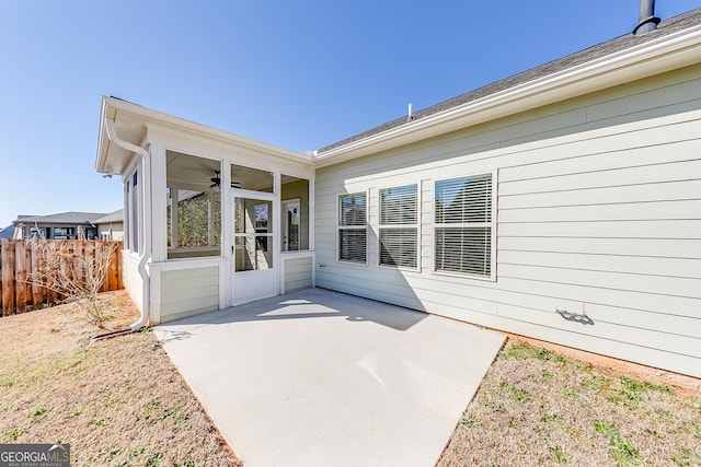 property entrance with a patio area and fence