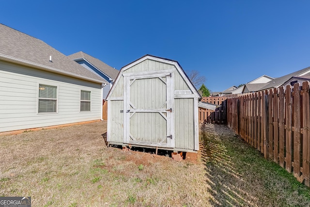 view of shed featuring a fenced backyard