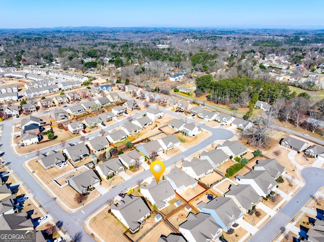 birds eye view of property with a residential view