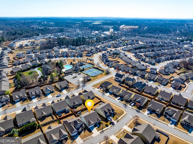 birds eye view of property with a residential view