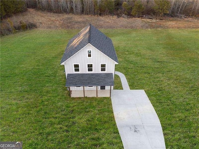 exterior space featuring a front yard and board and batten siding