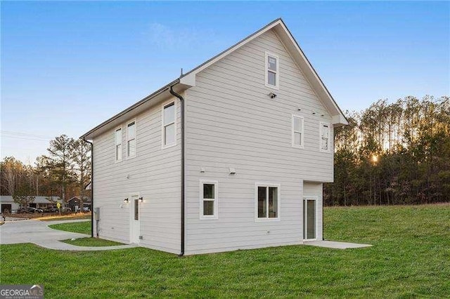 view of home's exterior featuring a lawn