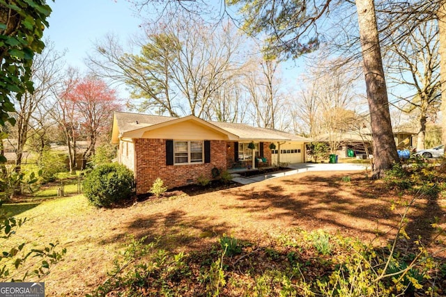 single story home featuring fence, concrete driveway, an attached garage, crawl space, and brick siding