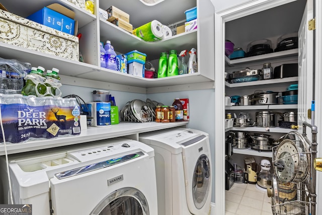 washroom featuring laundry area and washing machine and clothes dryer