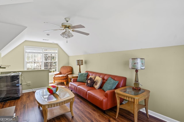 living room featuring visible vents, baseboards, lofted ceiling, wood finished floors, and a ceiling fan