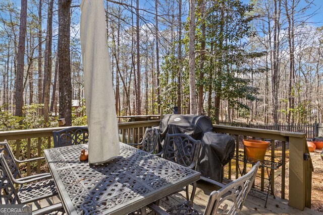 wooden deck with outdoor dining space