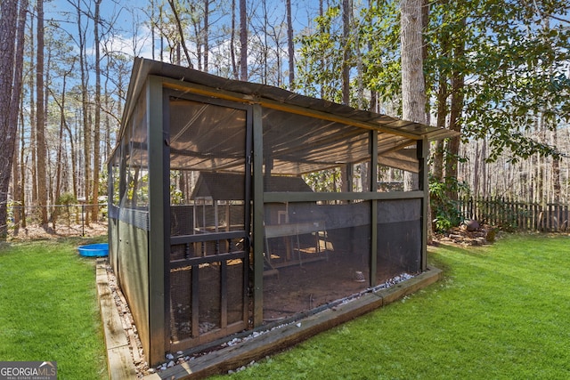 view of poultry coop with a lawn and fence