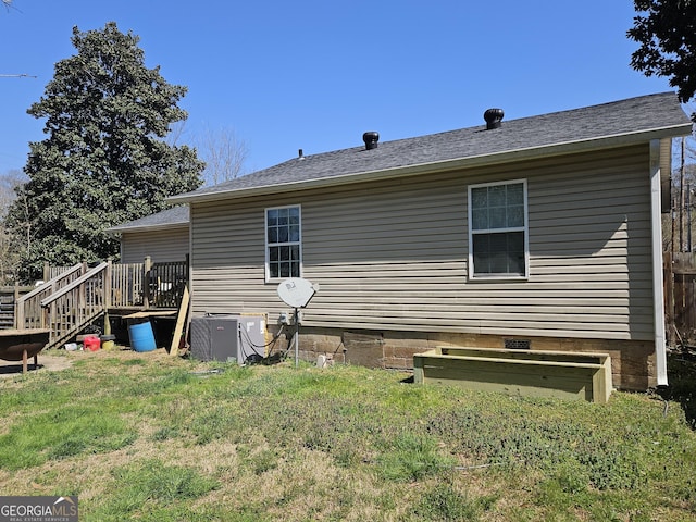 rear view of house with stairs, central air condition unit, a yard, and a wooden deck