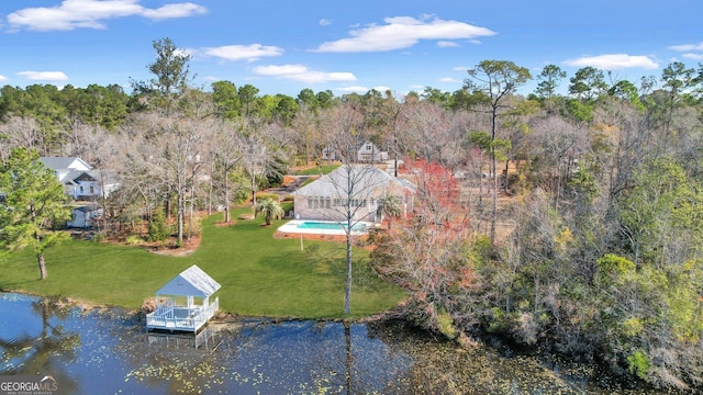 bird's eye view with a forest view and a water view