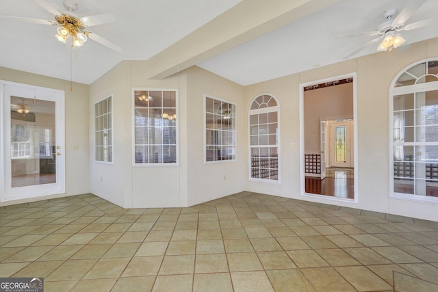 unfurnished sunroom with beamed ceiling and ceiling fan