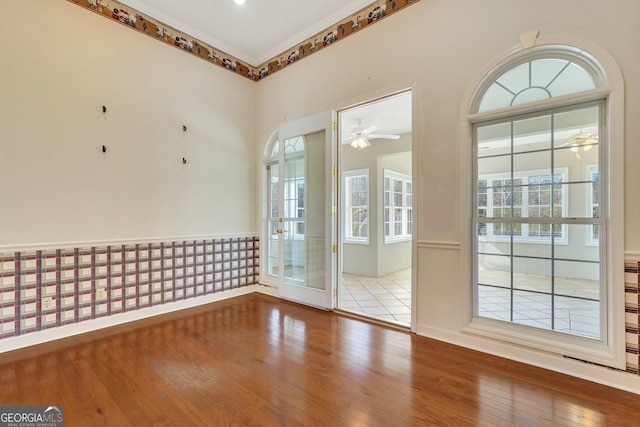 spare room featuring ceiling fan and hardwood / wood-style floors