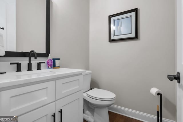 202 Via Lucca, Woodstock, GA 30188 - bathroom featuring vanity, toilet, wood finished floors, and baseboards
