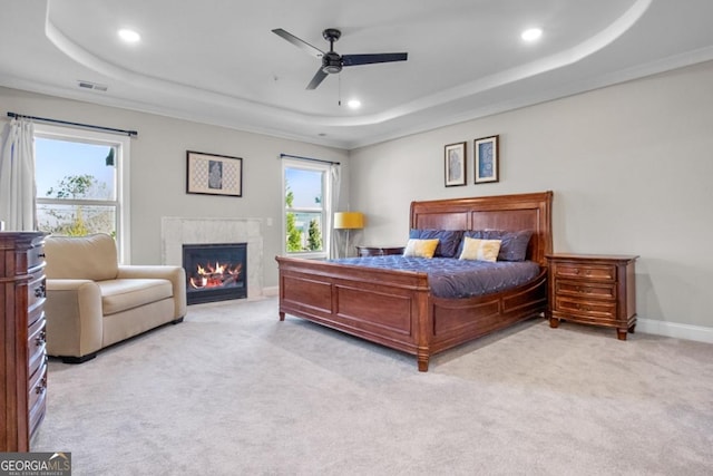 202 Via Lucca, Woodstock, GA 30188 - bedroom featuring light carpet, multiple windows, baseboards, and a tray ceiling