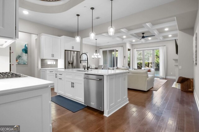 202 Via Lucca, Woodstock, GA 30188 - kitchen with coffered ceiling, open floor plan, stainless steel appliances, decorative backsplash, and dark wood-style flooring