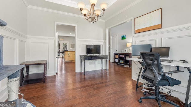 office space with a notable chandelier, a decorative wall, ornamental molding, and wood finished floors