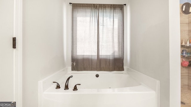 full bathroom featuring a whirlpool tub