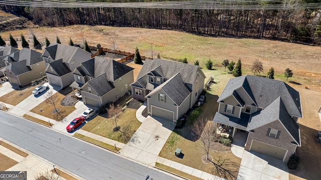 birds eye view of property with a residential view